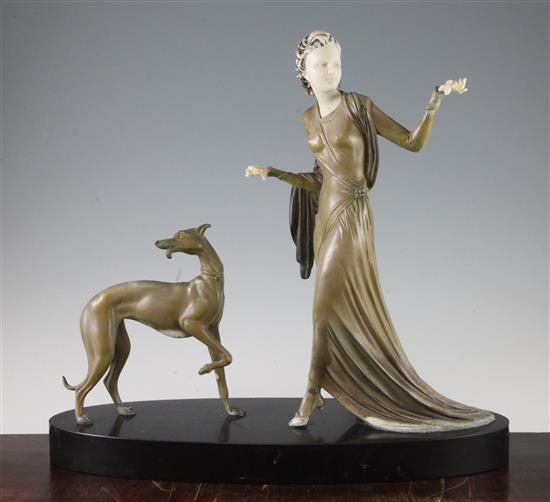 A French Art Deco patinated metal and ivorine figure group, 16.75in.